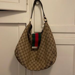 Gucci GG Canvas Web Hobo Bag. Used. 15” wide, 12”length.